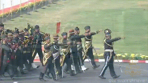 a group of soldiers marching in a parade with a watermark that says ' click shot ' on it