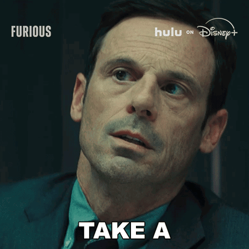 a close up of a man 's face with the words quick look behind him