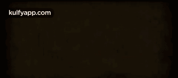 a blurred image of a yellow and red background with the words kulfyapp.com written on it .