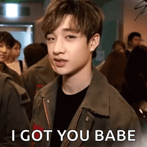 A Stray Kids member looks forward with “I GOT YOU BABE” text.