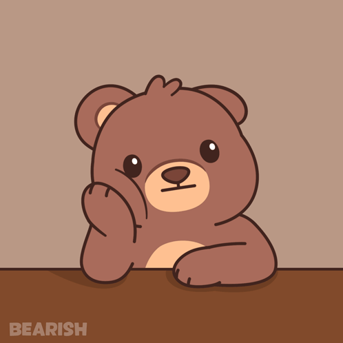 A brown cartoon bear rests its head on a table while waiting.