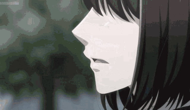 a close up of a girl 's face with her mouth open