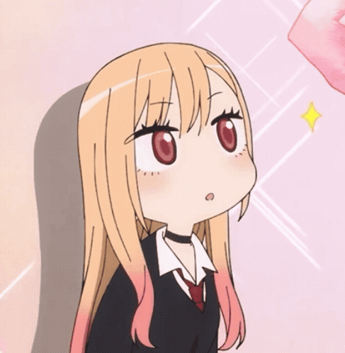 Marin Kitagawa looks to the side with a small surprised expression.
