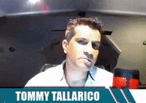 tommy tallarico is sitting in front of a computer monitor