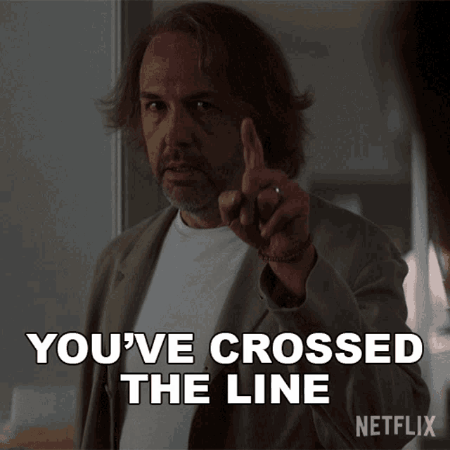 a man pointing with the words you 've crossed the line on the bottom