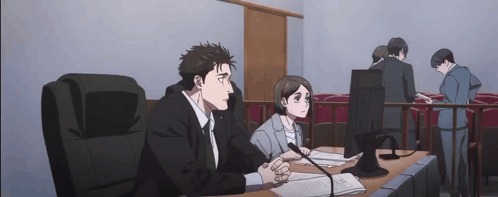 Hiromi Higuruma and another character sit tensely at a table in an anime courtroom scene.