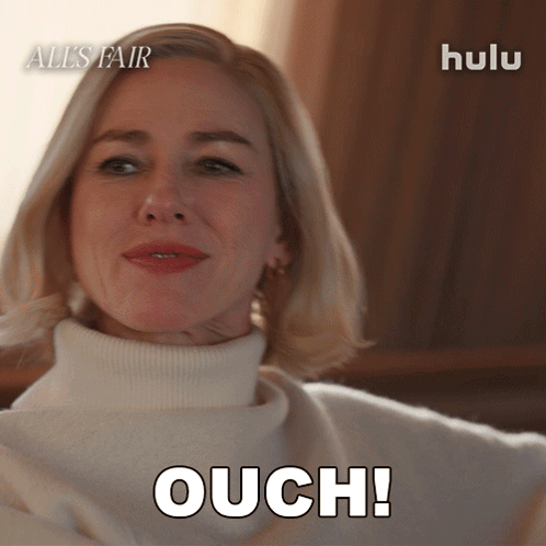 A woman reclines and says “OUCH!” in a Hulu scene.