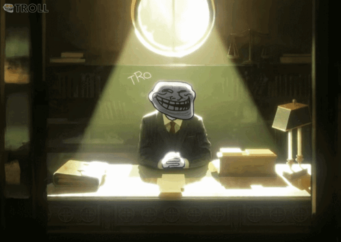 a troll sitting at a desk with the word tro written on the wall