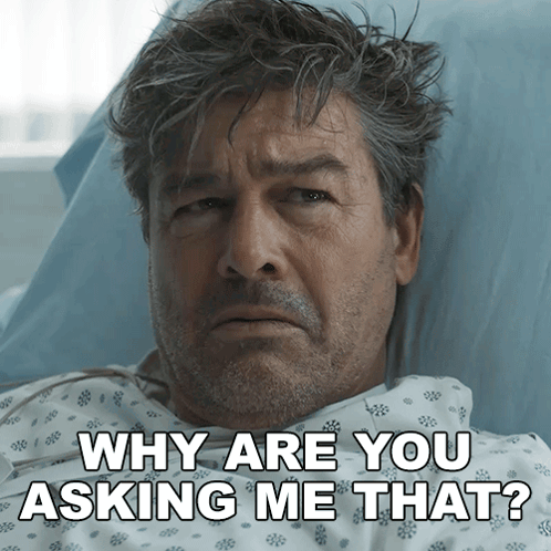 a man laying in a hospital bed with the words why are you asking me that