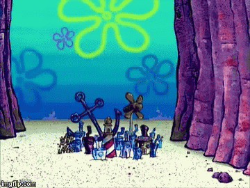 A group of tiny characters gathers outside a cave in a SpongeBob scene.