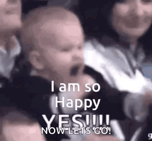 A child cheers in a crowd with “I AM SO HAPPY YES.”