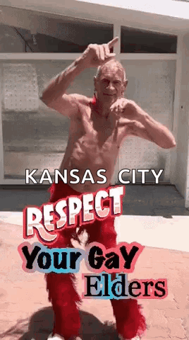 a shirtless man in red pants is dancing in front of a building with the words kansas city respect your gay elders .