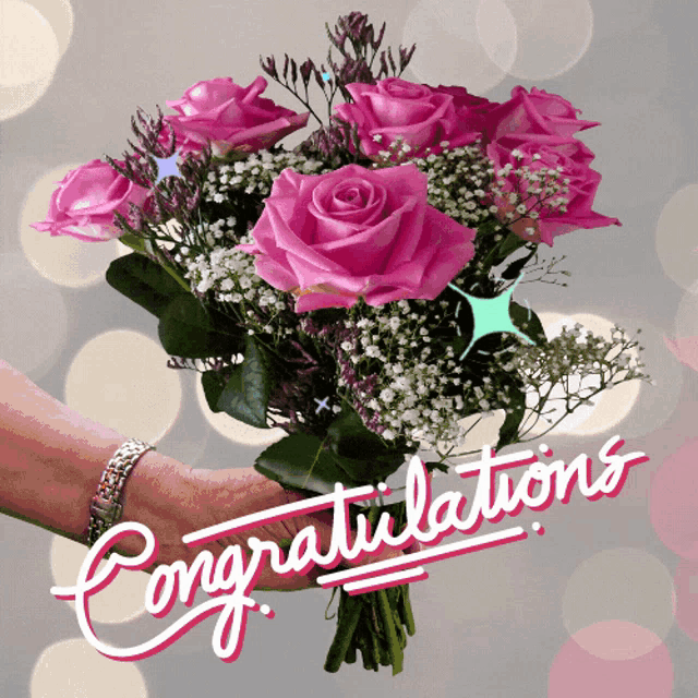 A bouquet of pink roses is overlaid with cursive “Congratulations.”