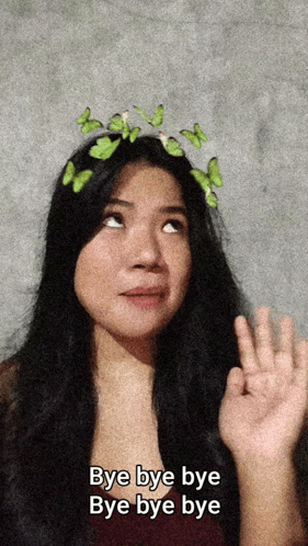 A woman wearing a flower crown waves with repeated “Bye bye bye” text.