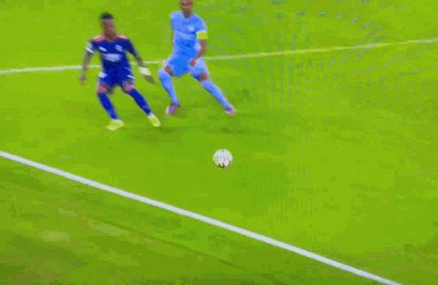 two soccer players are playing soccer on a field and one of them is wearing a number 20 jersey .