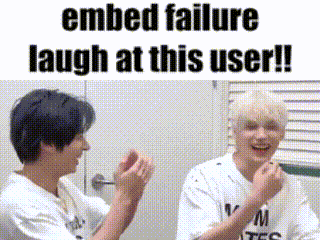 two young men are laughing at each other in a room with the words `` embedded failure laugh at this user ! ''