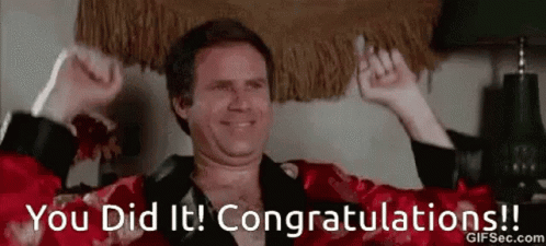 A man reclining on a couch lifts both arms while text says “You Did It! Congratulations!!”