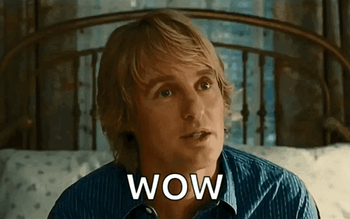 A man in a blue shirt looks up in surprise with “WOW” text.