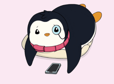 A black-and-white penguin lies beside a phone, looking bored.