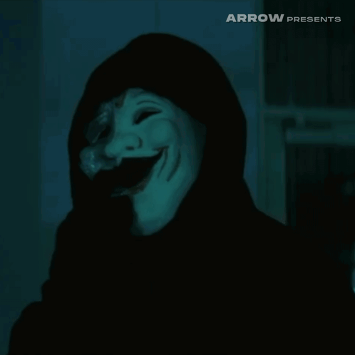 a person wearing a white mask and a black hood with the words arrow presents on the bottom