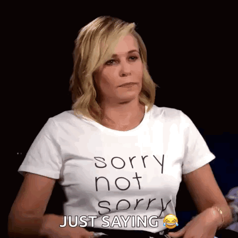 a woman is wearing a white t-shirt that says sorry not sorry just saying