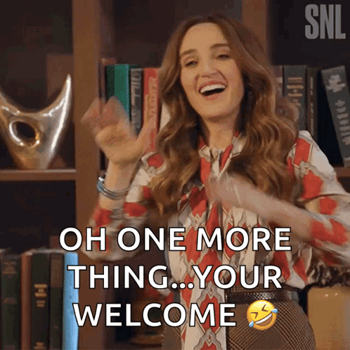 a woman says oh one more thing your welcome in front of a bookcase