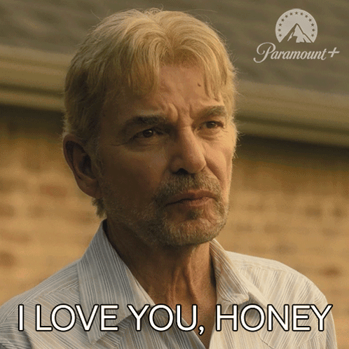 a man says i love you honey in front of a paramount sign