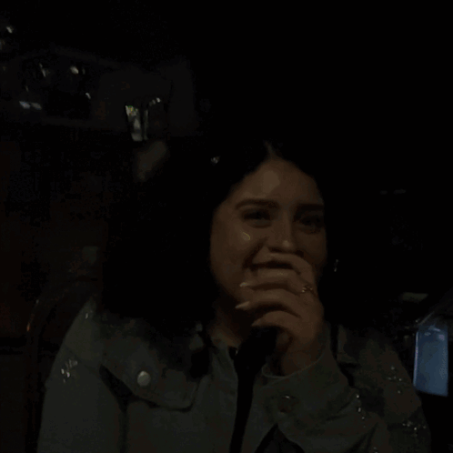 a woman covering her mouth with her hand and the words nervous above her