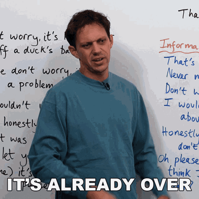 a man stands in front of a white board with the words " it 's already over "