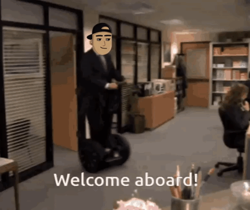 a man riding a segway in an office with the words welcome aboard