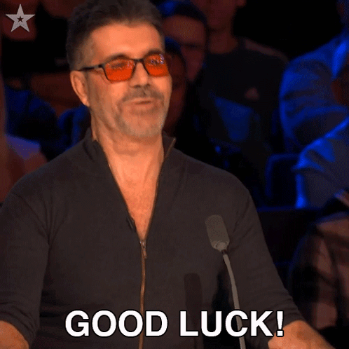 Simon Cowell looks unimpressed beneath a blunt “GOOD LUCK!” caption.
