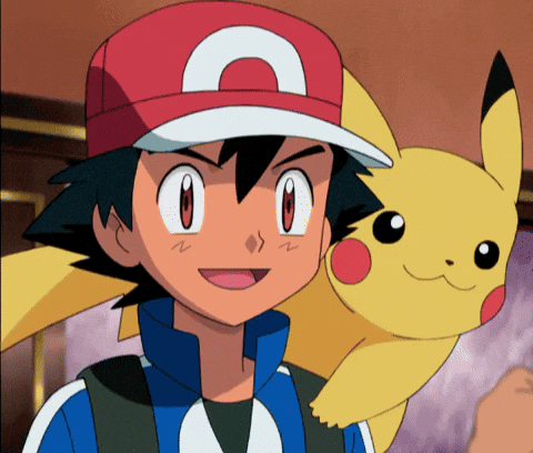 a boy wearing a red hat with the letter a on it is holding a pikachu