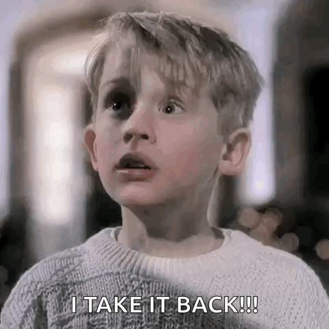 a young boy is wearing a sweater and saying `` i take it back ! ''