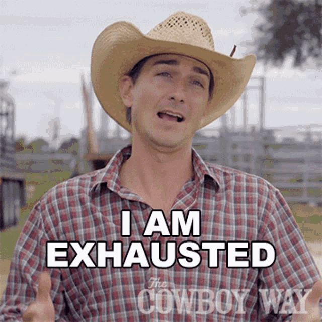 a man wearing a cowboy hat and plaid shirt says i am exhausted