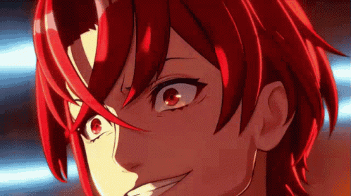 a close up of a red haired anime character with red eyes making a funny face .