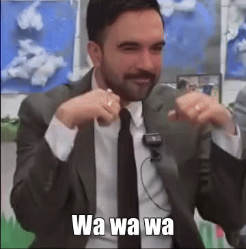 a man in a suit and tie is making a funny face with the words wa wa wa written below him