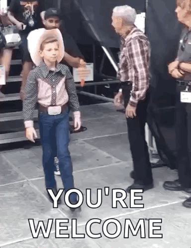 A child walks with a playful dance-like step on a city sidewalk.