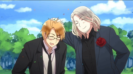 a man in a suit and tie stands next to another man in a suit and tie