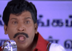 a man with a mustache is standing in front of a microphone with the word gazally written on the bottom right