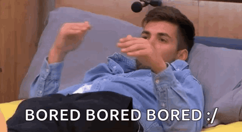 a man is laying on a bed with his hands on his face and the words `` bored bored bored '' written above him .