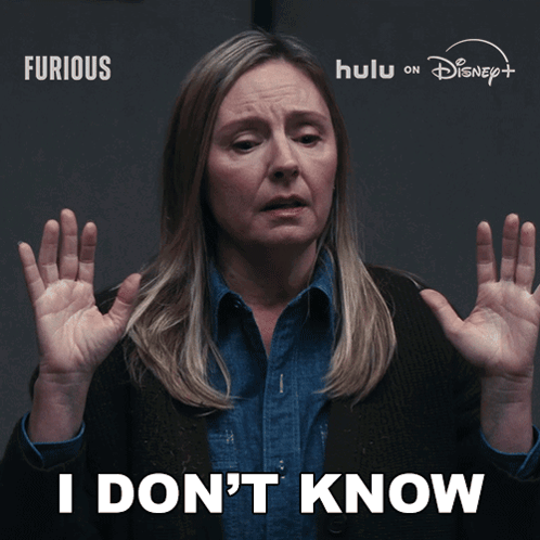 a woman says i don 't know with her hands up