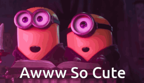Two pink Minions smile wide-eyed under “Awww So Cute.”