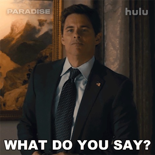 a man in a suit and tie is saying what do you say