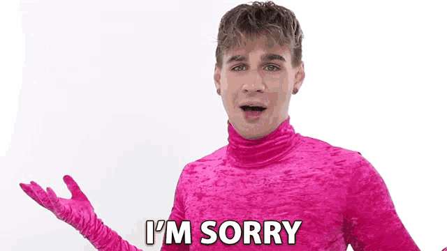 a young man in a pink turtleneck and gloves says i 'm sorry