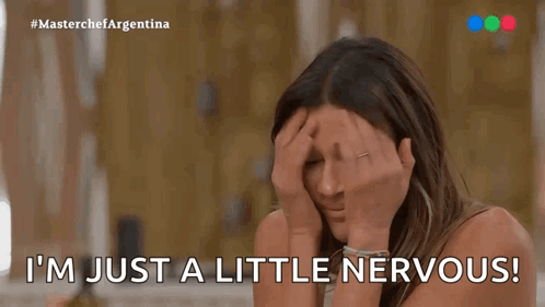 a woman with her hands on her head is saying i 'm just a little nervous