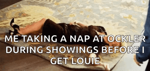 a woman is laying on a rug with a caption that says me taking a nap