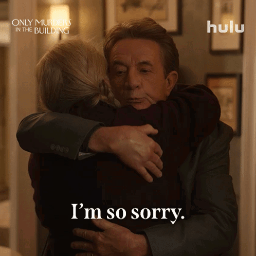 a man hugging a woman with the words i 'm so sorry on the bottom