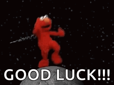 Elmo dances excitedly in outer space beneath huge “GOOD LUCK!!!” text.