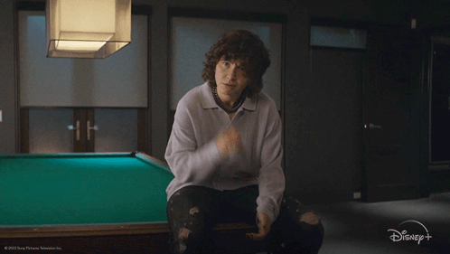 a person sitting in front of a pool table with the words soulmates written on the bottom