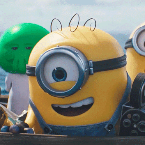a close up of a yellow minion wearing overalls